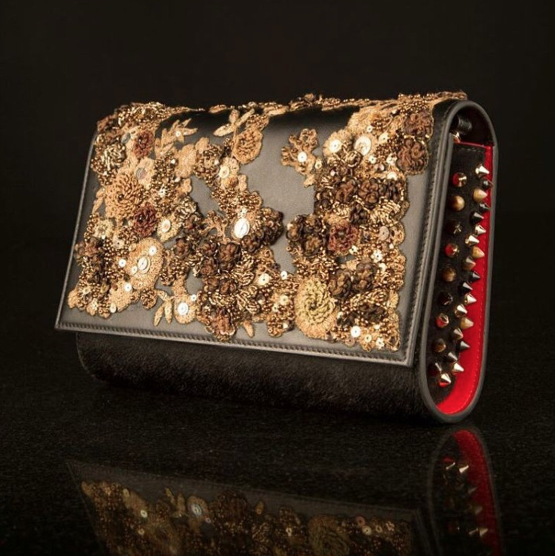 Sabyasachi Collection - Black and gold embellished clutch with spikes